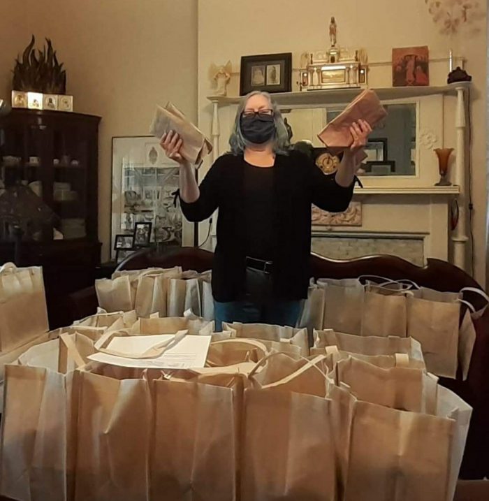 Packing face masks to give to the community
